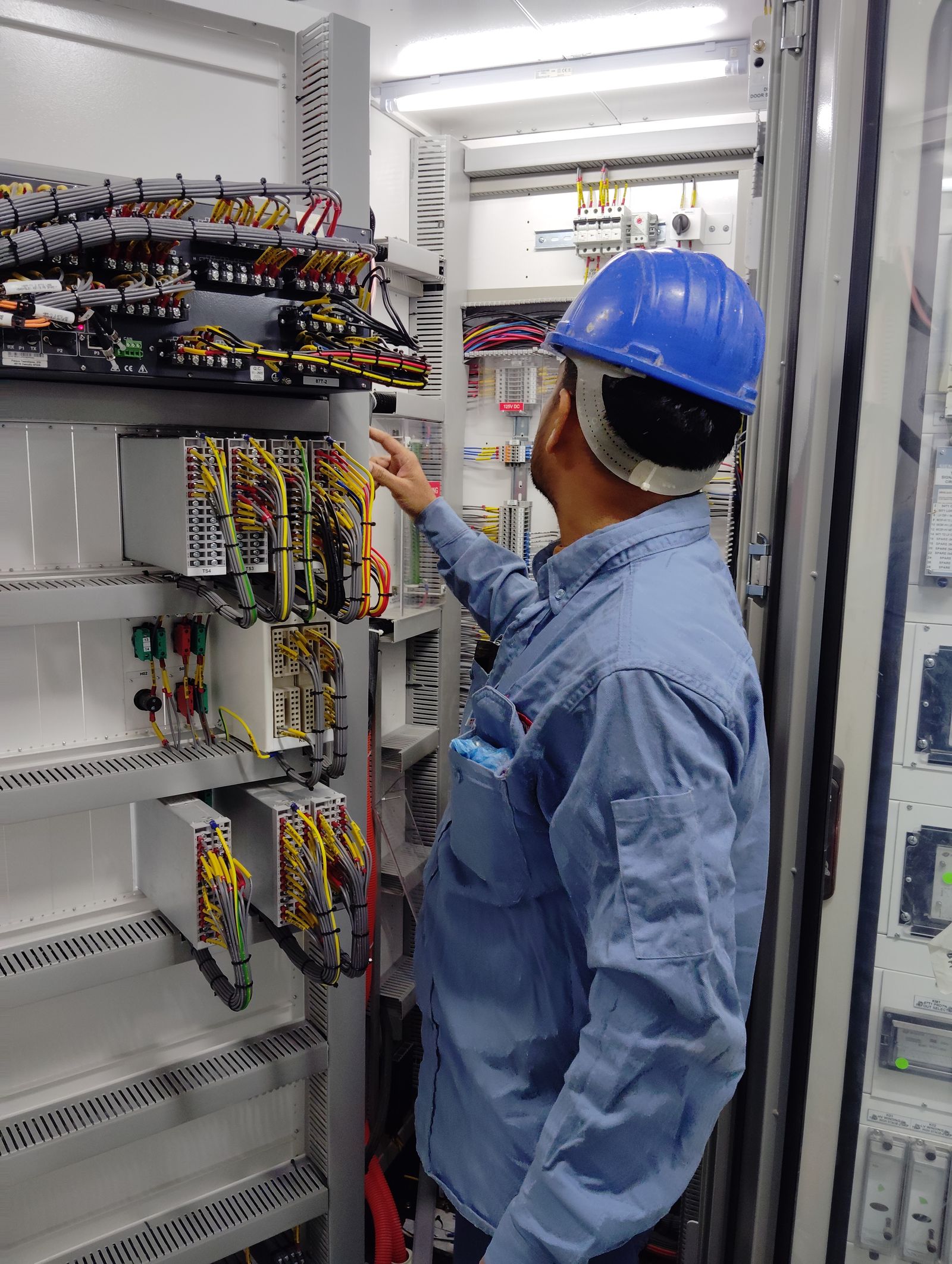 Open industrial enclosure. Dressed wire and terminal blocks.